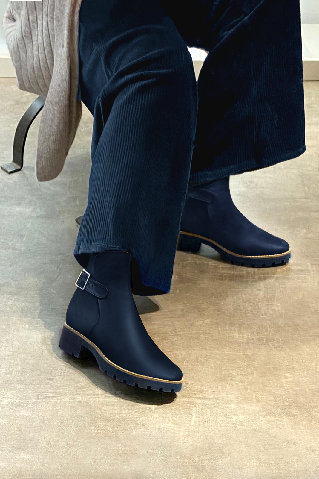 Navy blue women's ankle boots with buckles at the back. Round toe. Low rubber soles. Worn view - Florence KOOIJMAN